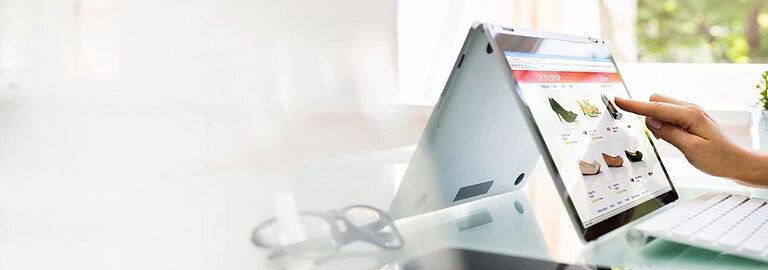 Person searches for products in an online-shop on their tablet
