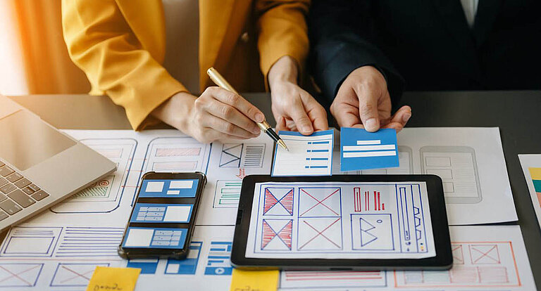Employees of a company plan the accessible structure of a website