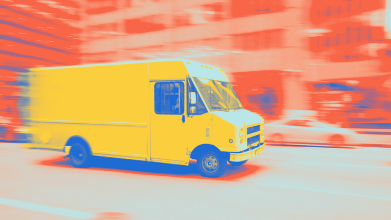Delivery van of a parcel service drives through the city